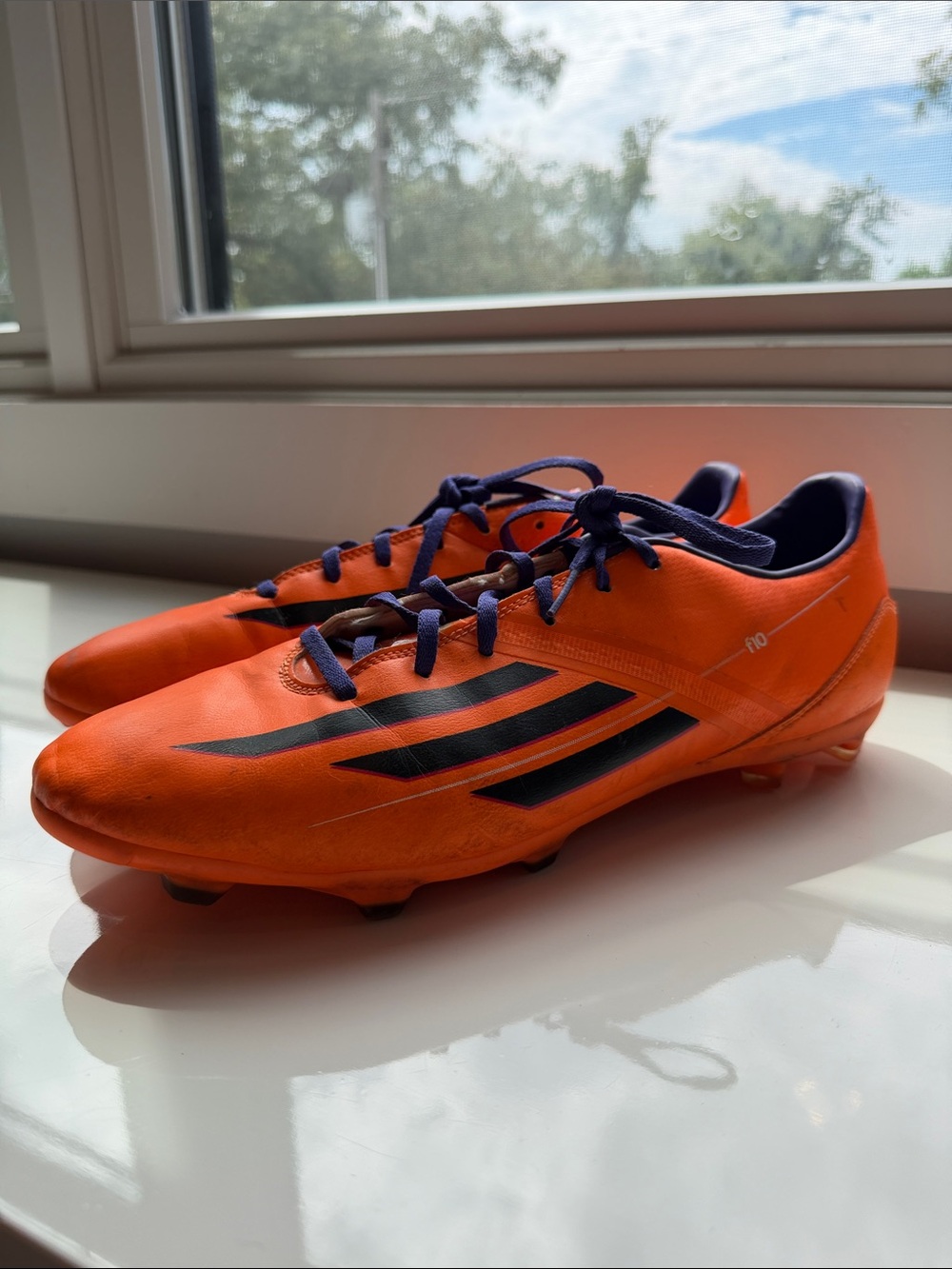 adidas Men’s 12 Bright Orange Soccer Cleats with purple Accents